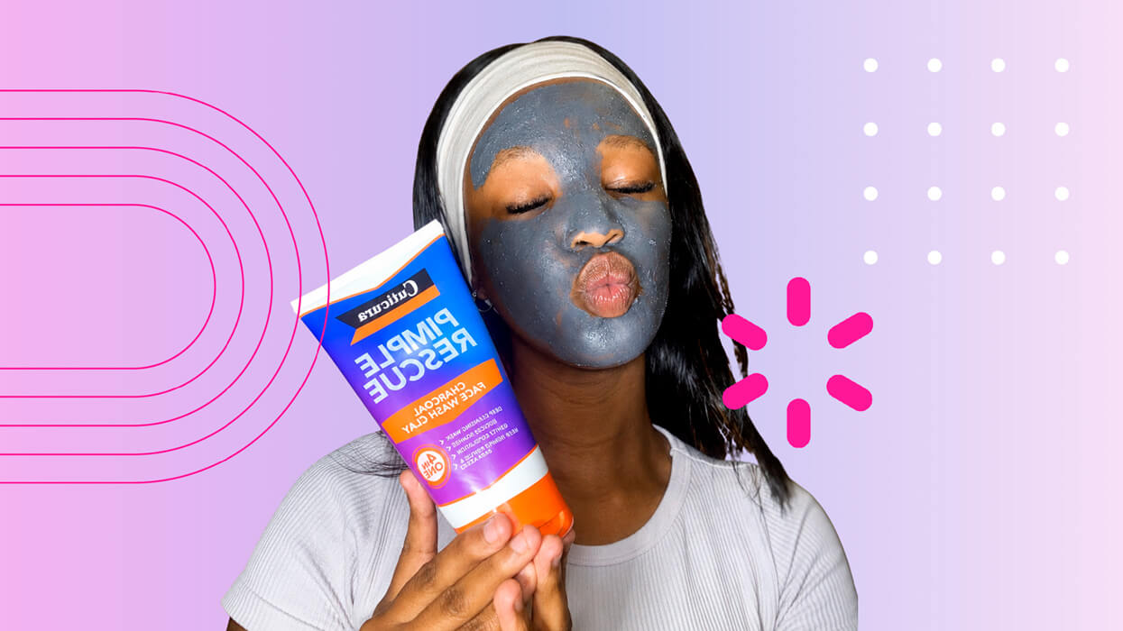 Young woman with a charcoal face mask holding a Cuticura Pimple Rescue tube against a pink and purple graphic background