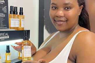 UGC creator holding a haircare product