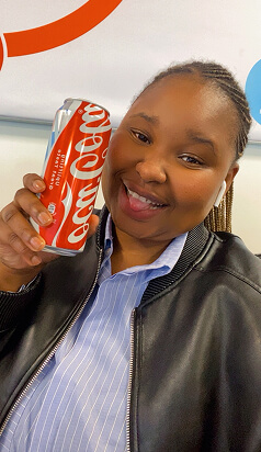 UGC creator with a Coca-Cola can