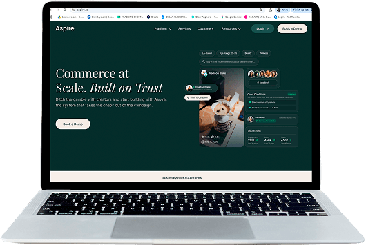 Aspire website on a laptop showing Commerce at Scale. Built on Trust.