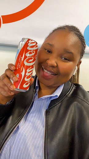 Nano influencer holding a Coca-Cola can in a branded partnership post