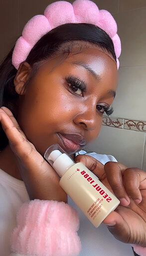 Nano influencer reviewing a skincare serum with a dropper bottle