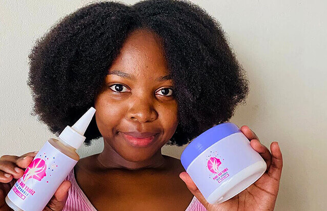 Customer holding Pearl and Yamiz hair products