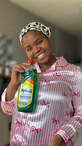 Creator holding household product